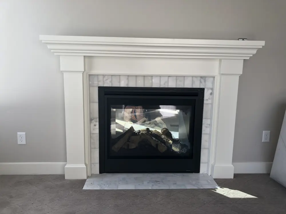 New gas fireplace with a white mantel surround, a job by I Know A Guy HVAC in the Salt Lake Valley