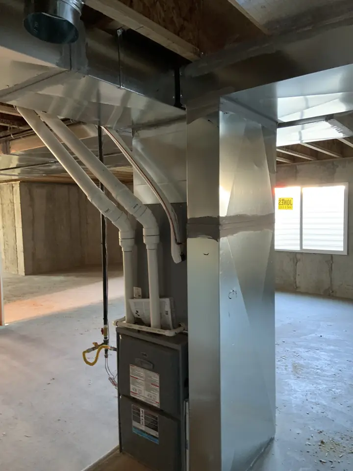 Gas furnace with new venting and ductwork connections in an unfinished basement, a job by I Know A Guy HVAC in the Salt Lake Valley